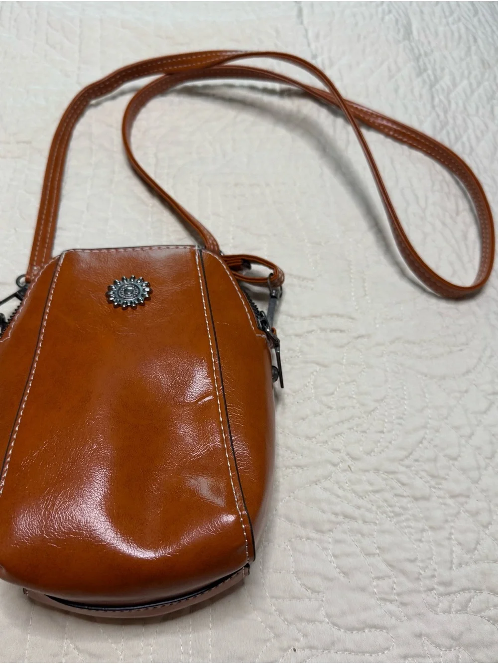 Source Unknown Tan vegan Leather Crossbody Bag with Silver Emblem